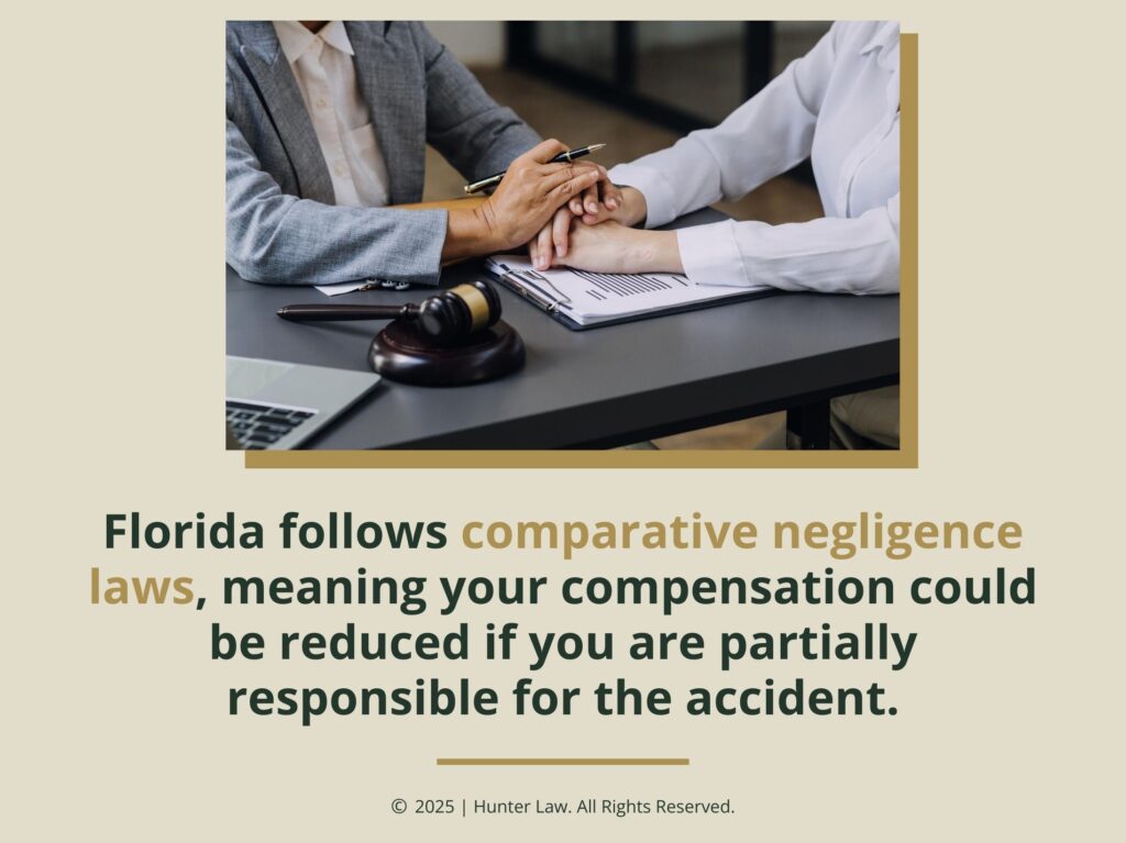 Lawyer places hands on client's hand for support in consultation- Florida follows comparative negligence laws quote.