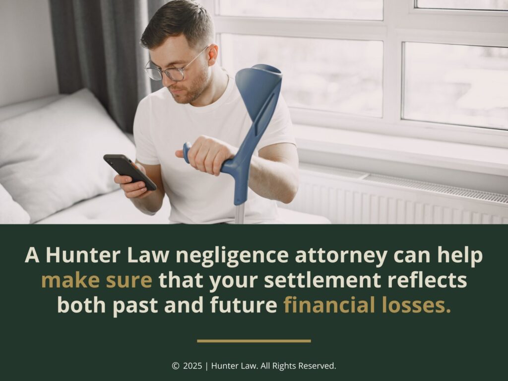 Man checking phone on side of bed holding a crutch- Hunter Law negligence attorney helps protect your settlement.